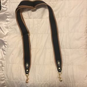 Wide adjustable black and tan replacement strap with gold tone hardware